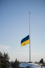 Kyiv, Ukraine. November 30, 2023: on the last day of autumn, the Ukrainian flag was lowered due to weather conditions