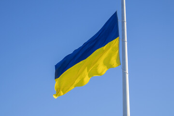 Kyiv, Ukraine. 11/30/2023: the national flag of Ukraine against the background of the blue sky