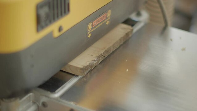 Wood going through planner