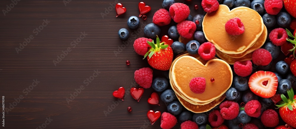 Poster Heart shaped mini pancakes topped with berries make for a tasty Valentine s Day breakfast with a lovely food backdrop Copy space image Place for adding text or design