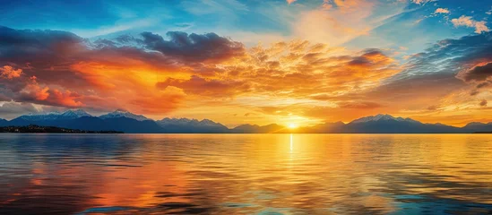 Papier Peint photo Destinations Golden clouds mirror in the water during a vibrant sunset on Lake Geneva in Switzerland Copy space image Place for adding text or design