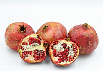 Whole and broken pomes of pomegranates (Punica granatum) in the autumn