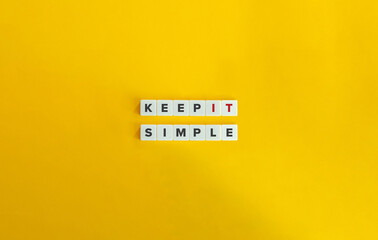 Keep It Simple Phrase. Block Letter Tiles on Yellow Background. Minimalist Aesthetics.