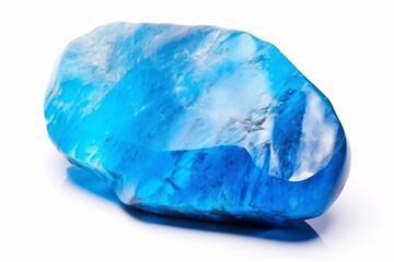 Isolated turkvenit, a semiprecious blue gemstone, lies on a white surface, signifying mineral science.