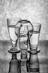 Still life with glass objects on a gray background