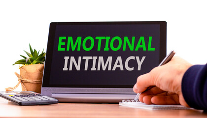 Emotional intimacy symbol. Concept words Emotional intimacy on beautiful black tablet. Beautiful white background. Calculator. Psychologist hand. Psychology emotional intimacy concept. Copy space.