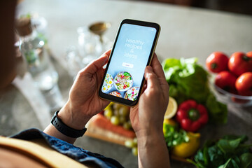 Woman Searching for Healthy Recipe Ideas on Smartphone