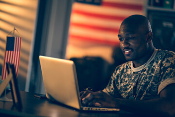 Smiling young soldier working in military base