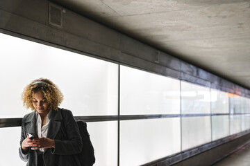 Woman with headphones and smartphone