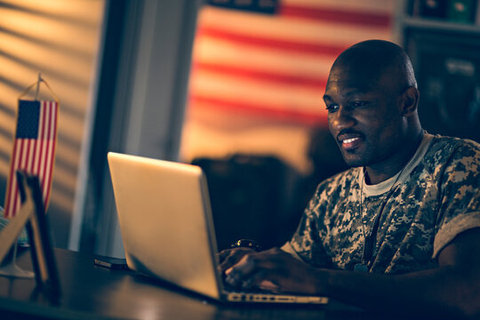 Smiling young soldier working in military base