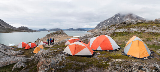 Greenland, Sermersooq, Kulusuk, Schweizerland Alps, group of people at camp - obrazy, fototapety, plakaty
