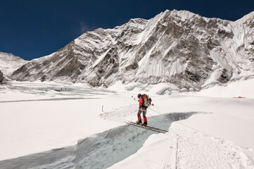 Nepal, Solo Khumbu, Everest, Sagamartha National Park, Mountaineer crossing icefall on a ladder