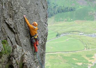 United Kingdom, Lake District, Langdale Valley, Gimmer Crag, climber on rock face