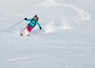 Switzerland, Grand Saint Bernard Pass, Pain de Sucre, Mont Fourchon, woman on a ski tour in the mountains riding downhill