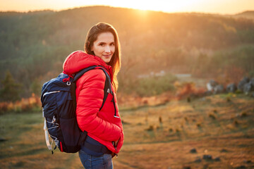 Portrait of smiling woman on a hiking trip in the mountains