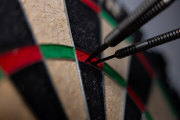 Close-up of dartboard 180 score. Three arrows in triple twenty. Business goal concept.