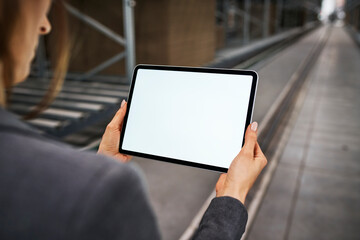 Close-up of businesswoman holding tablet in factory