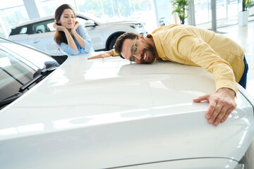 Fototapeta premium Photo of loving couple in car center