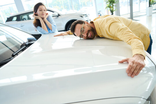 Photo of loving couple in car center