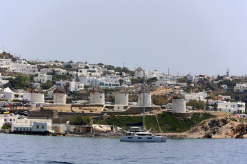 Coastal view of the Cyclades island of Mykonos with its famous windmills-Greece