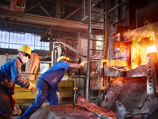 Industry, Smeltery, Workers checking blast furnace for fractures