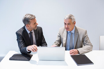 Two businessmen working together in office