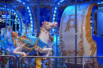 Carousel rides for children in amusement park