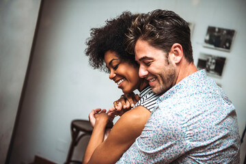 Close-up of romantic couple embracing while dancing in bar