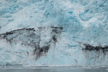 Ice falling from the front of a Tidewater Glacier, Alaska, USA