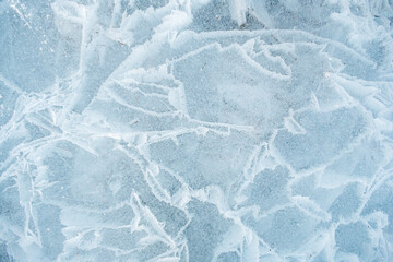 Obraz premium Background frozen water with fancy patterns. Ice texture. Cracks and bubbles inside frozen water.