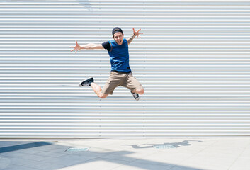 Young man jumping in the air