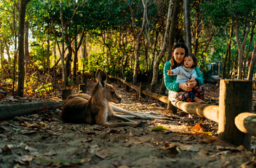 Australia, Queensland, Mackay, Cape Hillsborough National Park, mother and little daughter watching...