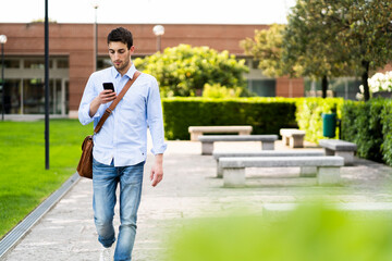Young man using smartphone in the city