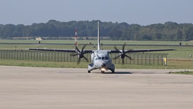 Small Casa Military Transport Aircraft from air force Taxiing at Air Base after landing turning on the taxiway