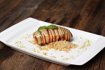 Pumpkin dessert with tahini and hazelnuts