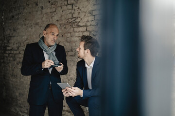 Senior and mid-adult businessman having a meeting