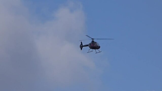 Helicopter flying towards the camera at regional airfield airport
