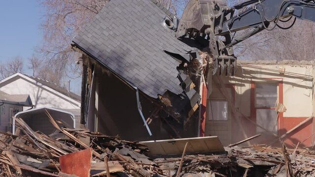 Abandoned house being demolished