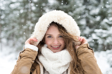 Portrait of smiling young woman in winter