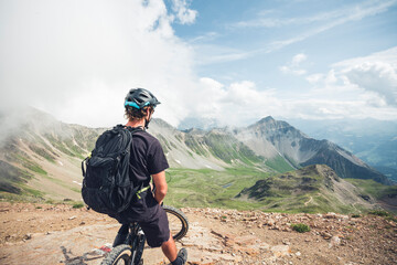 Mountainbiker on viewpoint on Lenzerheide in Grisons, Switzerland