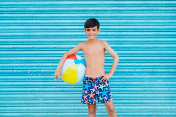 Portrait of smiling boy with beach ball