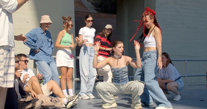 Young people actively participating in dance activities with an emphasis on improvisation. Dancers create movements on the spot. 10.09.23 Folimanka, Prague, CZ