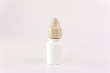 A bottle of medicine in the form of drops on a white background.