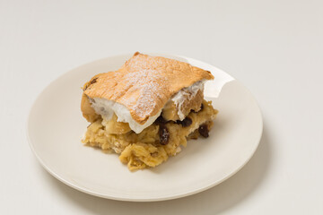 Sweet food. Bun with apples and raisins.