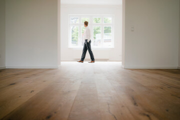 Businessman walking in empty flat