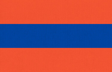 Fototapeta premium flag of Duchy of Nassau on fabric surface. Historical flag of part of Europe