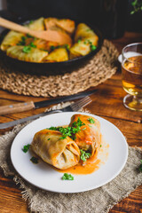 Stuffed Cabbage Rolls on White Plate Served with Chopped Parsley