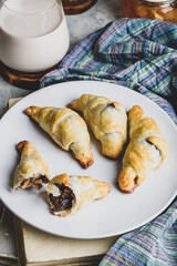 Croissants stuffed with nuts and chocolate for breakfast