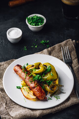 Baked pork sausage with green bell peppers, onion and herbs