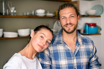 Portrait of a happy young couple at home